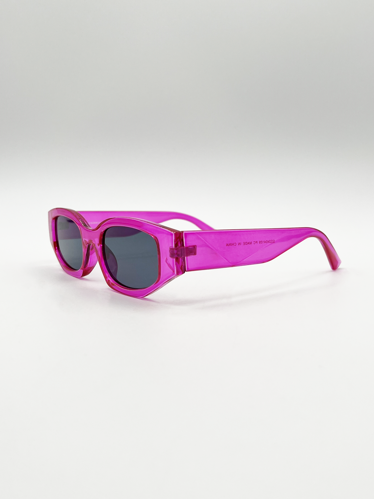 Angular Sunglasses in Translucent Hot Pink